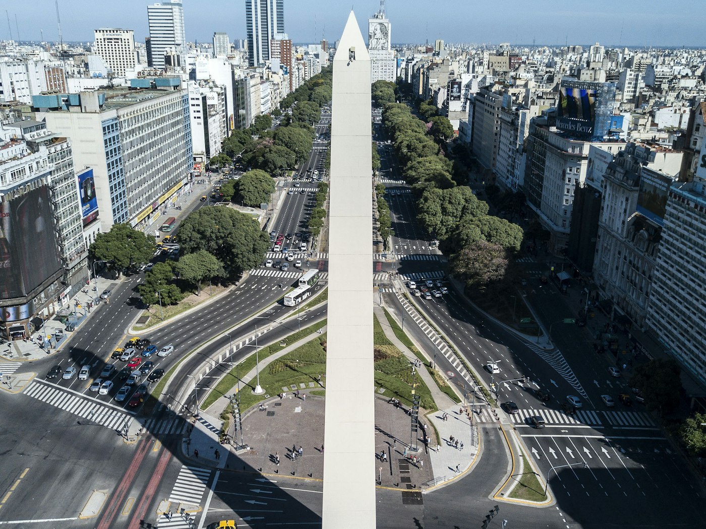 The Obelisco standing at the centre of the wide Avenida 9 de Julio in Buenos Aires.